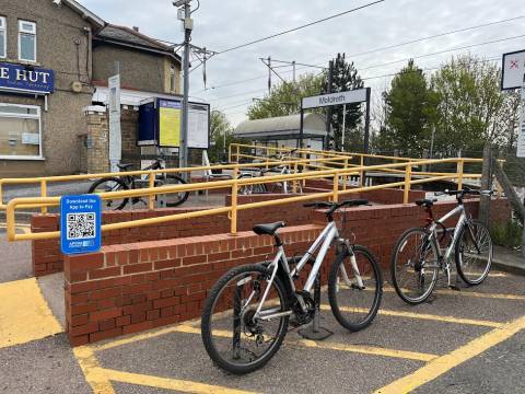 Photograph of bicycles chained up at Meldreth station