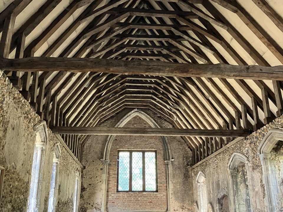 Photograph of the inside of Duxford Chapel showing the roof beams