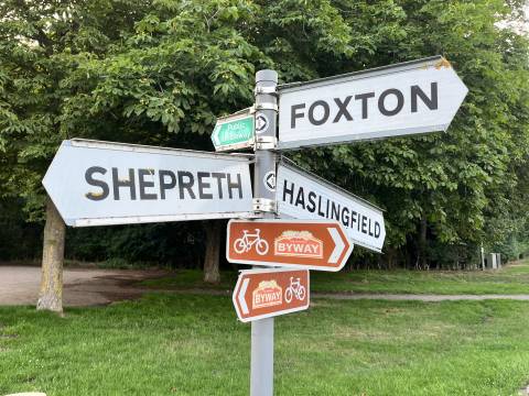 Photograph of a sign post with signs pointing towards Shepreth, Foxton and Haslingfield. Additional signs show a public bridleway and the National Cycling Byway.