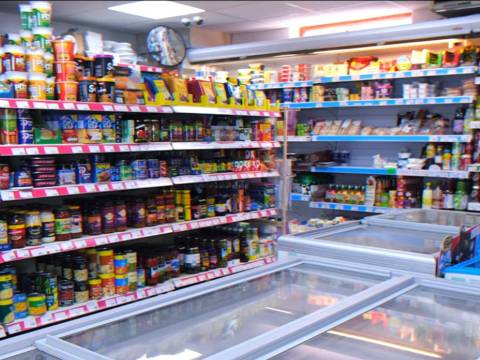 Photograph of the interior of Foxton Shop showing shelves of food and freezers